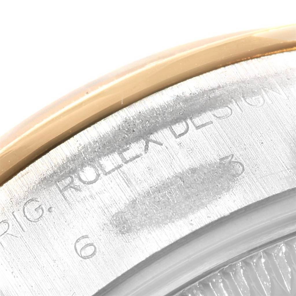 Close-up of the bezel and engraved markings on the case of a Rolex Datejust 69163 Women's Stainless Steel Champagne Dial 69163 Women's Stainless Steel Champagne Dial watch.