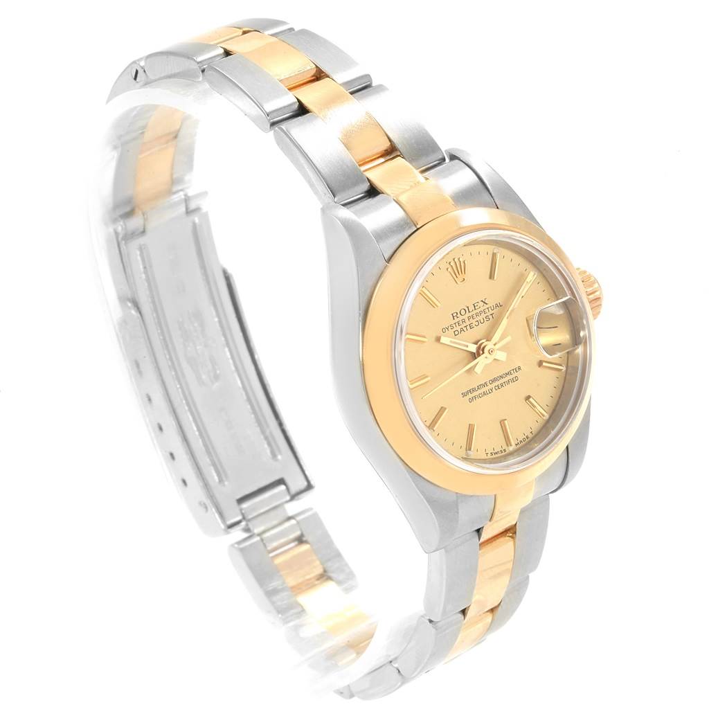 The Rolex Datejust 69163 Women's Stainless Steel Champagne Dial 69163 Women's Stainless Steel Champagne Dial watch is shown at an angle highlighting the dial, bezel, and metal bracelet in two-tone gold and silver.