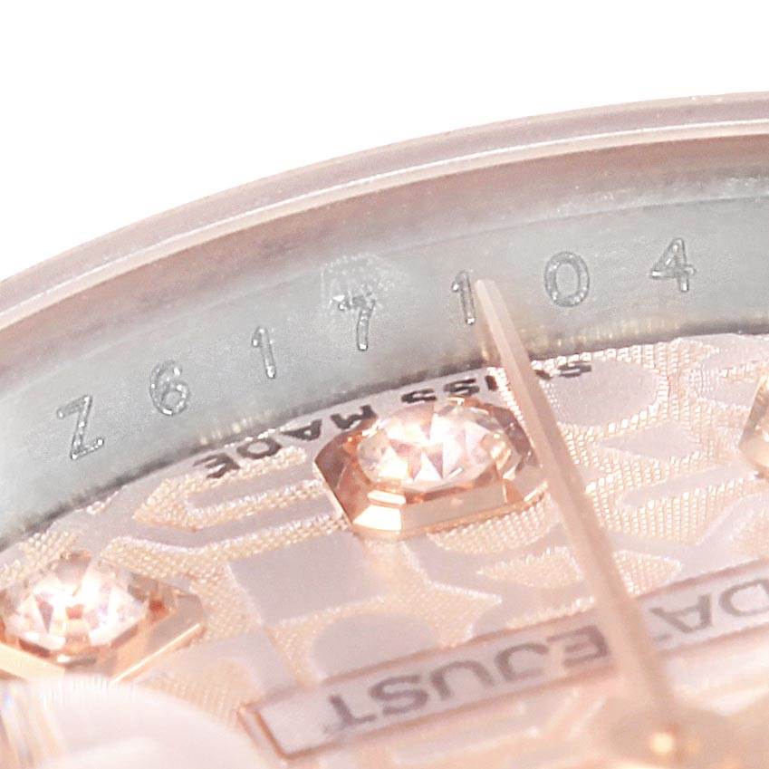 This image shows a close-up angle focusing on the dial and part of the serial number of the Rolex Datejust 179171 Women's Steel and Gold (two tone) Pink Dial 179171 Women's Steel and Gold (two tone) Pink Dial watch.