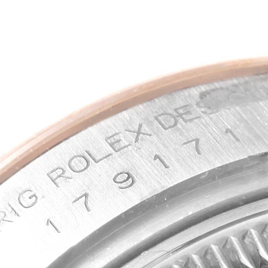 The image shows a close-up of the serial number and part of the bezel of a Rolex Datejust 179171 Women's Steel and Gold (two tone) Pink Dial 179171 Women's Steel and Gold (two tone) Pink Dial watch.