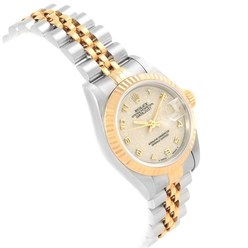 The Rolex Datejust 69173 Women's Stainless Steel Beige Dial 69173 Women's Stainless Steel Beige Dial watch is shown at an oblique angle, highlighting the gold and silver band and detailed face.