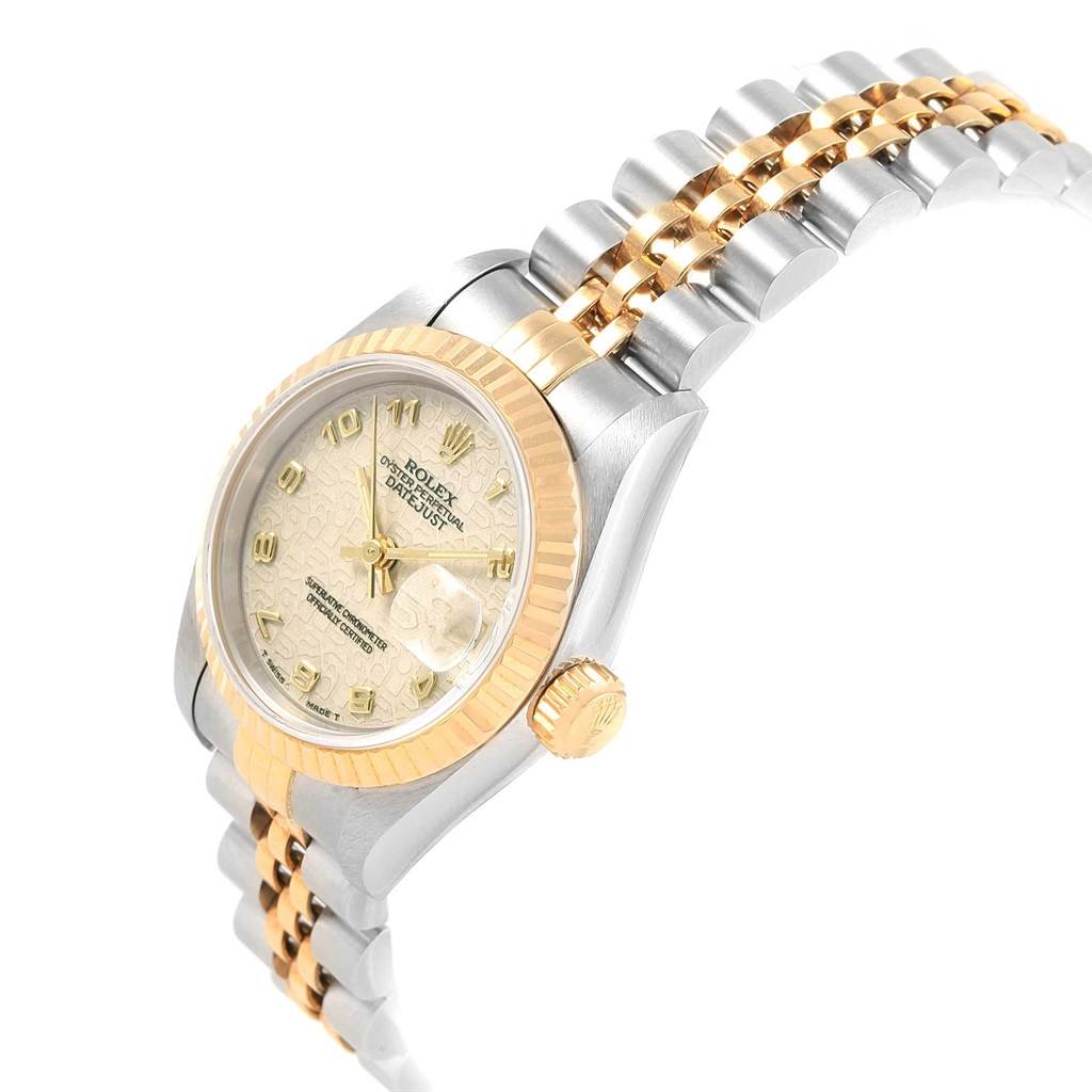 This image shows a side angle of a Rolex Datejust 69173 Women's Stainless Steel Beige Dial 69173 Women's Stainless Steel Beige Dial watch, highlighting its bezel, dial, and bracelet.