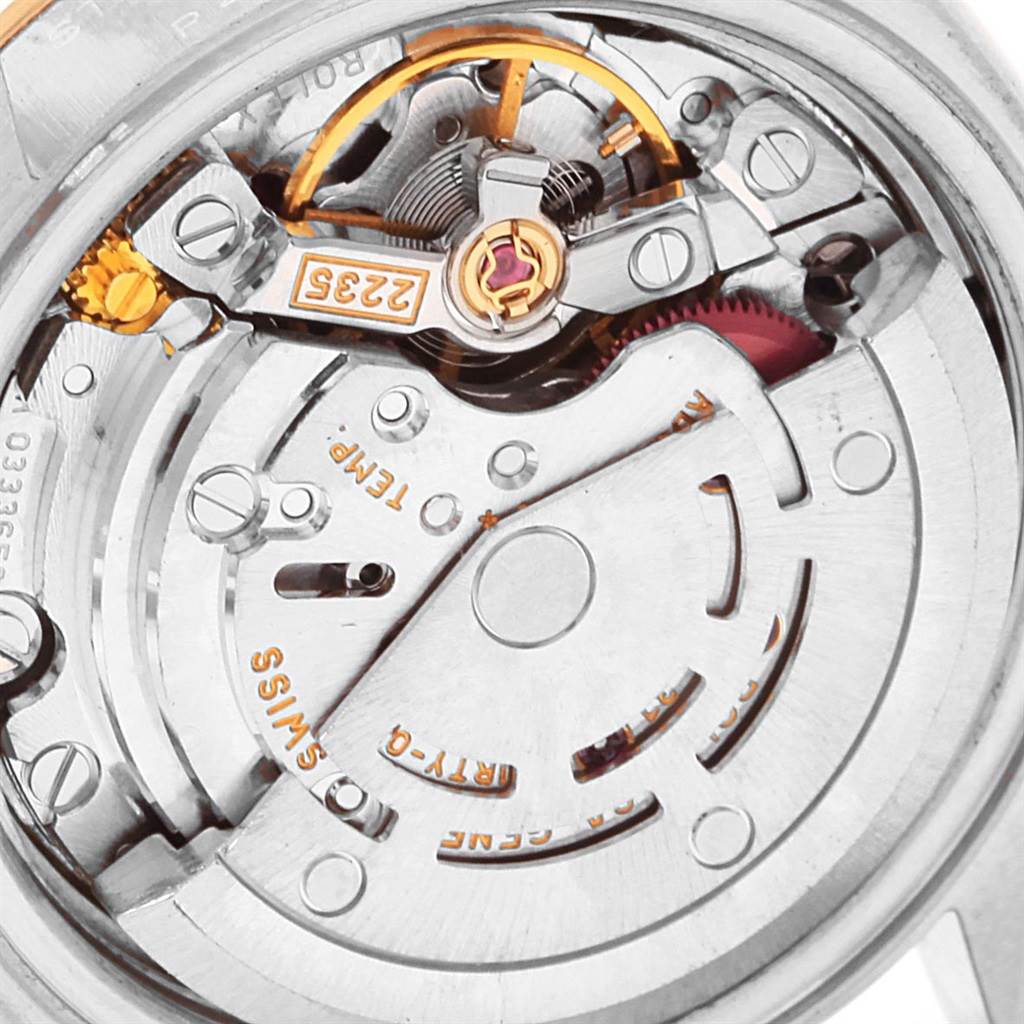 The image shows the internal movement mechanism of a Rolex Datejust 69173 Women's Stainless Steel Beige Dial 69173 Women's Stainless Steel Beige Dial watch, focusing on the intricate details of its components.