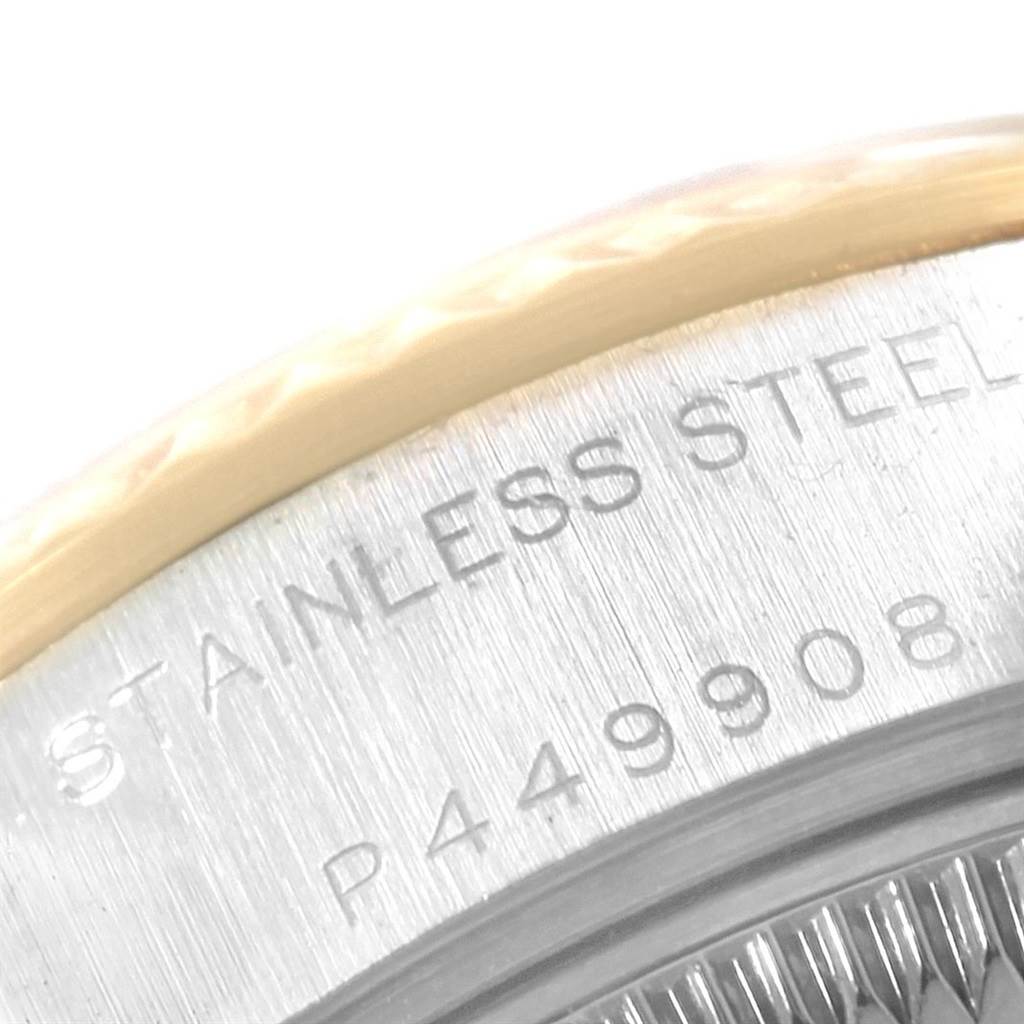 The image shows a close-up of the case back of a Rolex Datejust 69173 Women's Stainless Steel Beige Dial 69173 Women's Stainless Steel Beige Dial watch, highlighting the text "Stainless Steel" and part of the serial number.