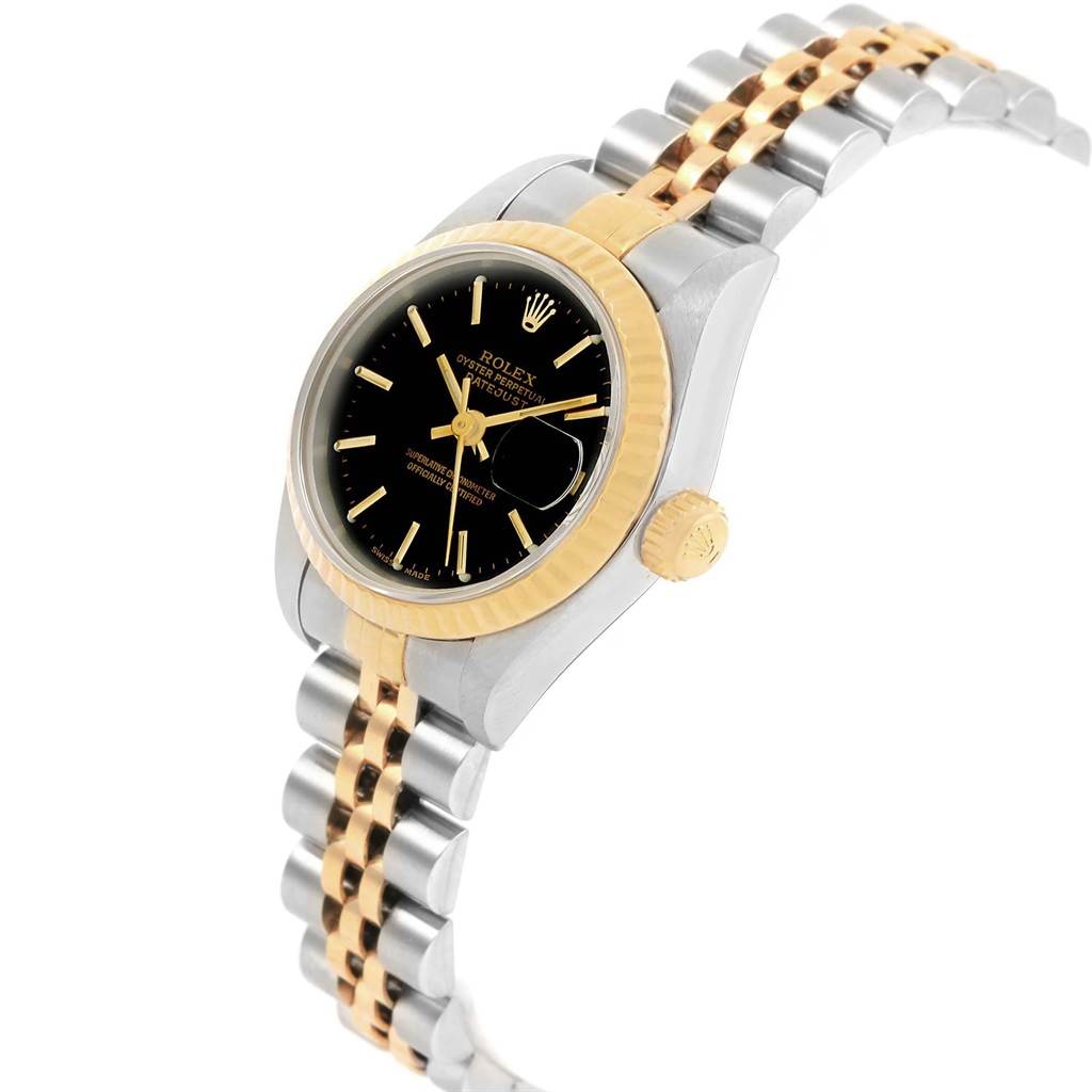 This image shows an angled view of a Rolex Datejust 79173 Women's Stainless Steel Black Dial 79173 Women's Stainless Steel Black Dial watch, highlighting its black dial, fluted bezel, and two-tone bracelet.