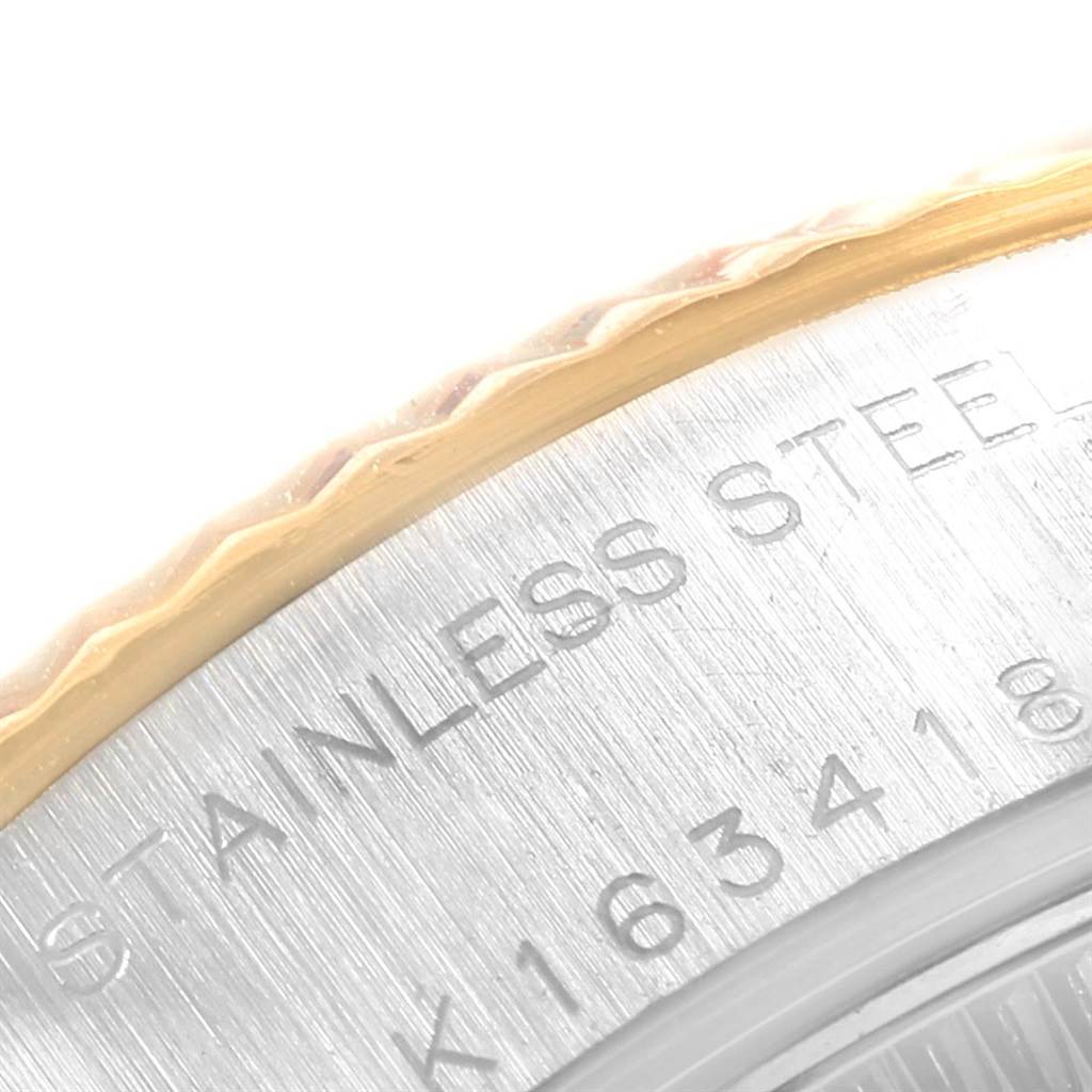This close-up image shows part of the bezel and case back of a Rolex Datejust 79173 Women's Stainless Steel Black Dial 79173 Women's Stainless Steel Black Dial watch, highlighting the "STAINLESS STEEL" engraving.