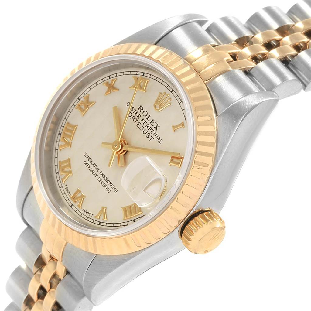 The Rolex Datejust 69173 Women's Stainless Steel Beige Dial 69173 Women's Stainless Steel Beige Dial watch is shown at an angled close-up, highlighting its bezel, dial, and crown.
