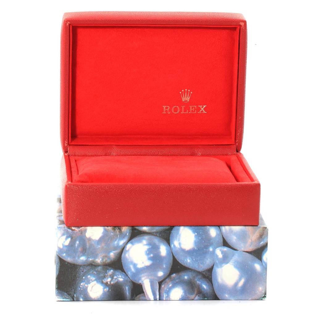 This image shows an open red watch box for a Rolex Datejust 69173 Women's Stainless Steel Beige Dial 69173 Women's Stainless Steel Beige Dial, displaying the interior with a cushion.