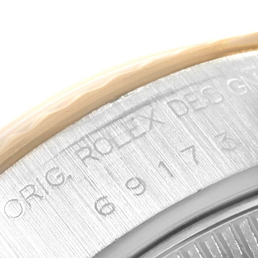 This image shows the engraved details on the side bezel of a Rolex Datejust 69173 Women's Stainless Steel Beige Dial 69173 Women's Stainless Steel Beige Dial watch.