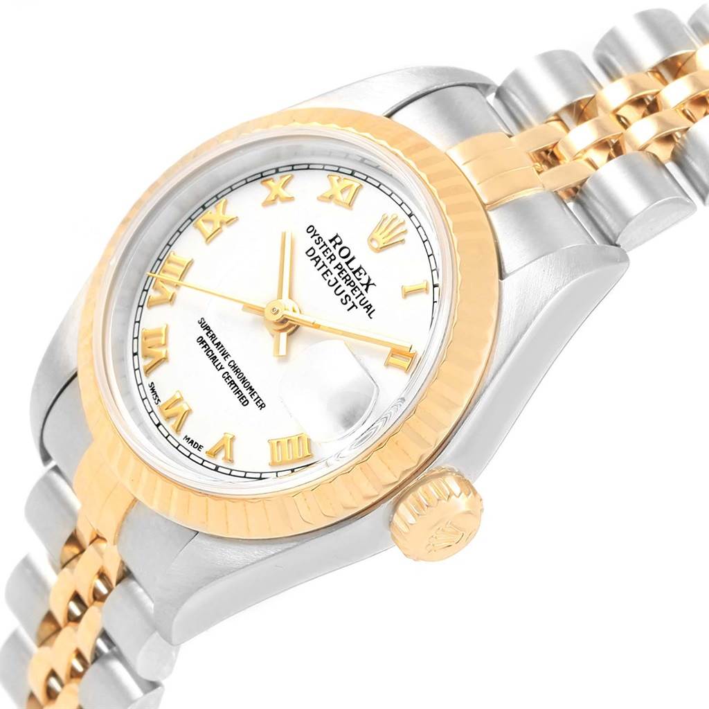 The image shows an angled view of a Rolex Datejust 79173 Women's Steel and Gold (two tone) White Dial 79173 Women's Steel and Gold (two tone) White Dial watch, highlighting the dial, bezel, crown, and part of the bracelet.