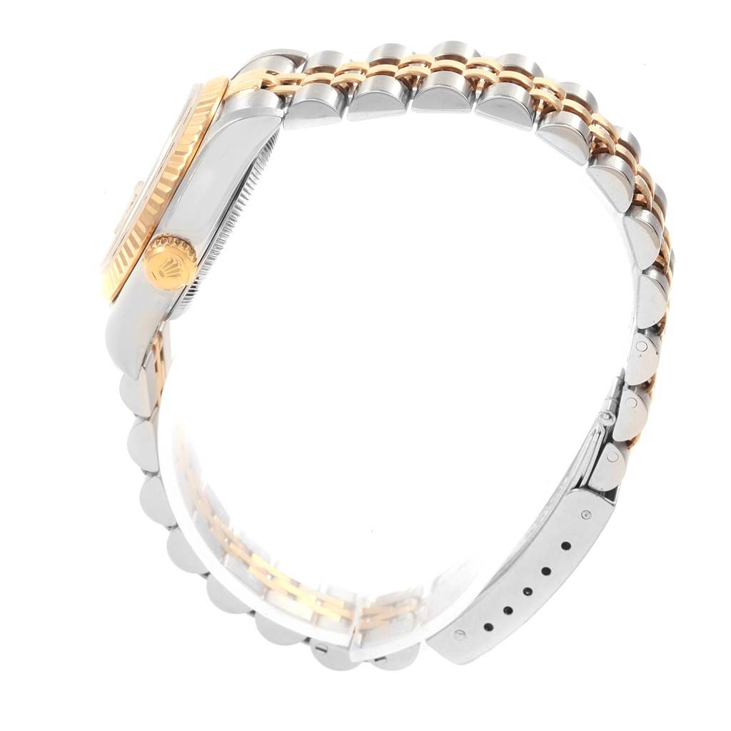 The image shows a side view of a Rolex Datejust 79173 Women's Steel and Gold (two tone) White Dial 79173 Women's Steel and Gold (two tone) White Dial watch, highlighting the two-tone bracelet and crown.