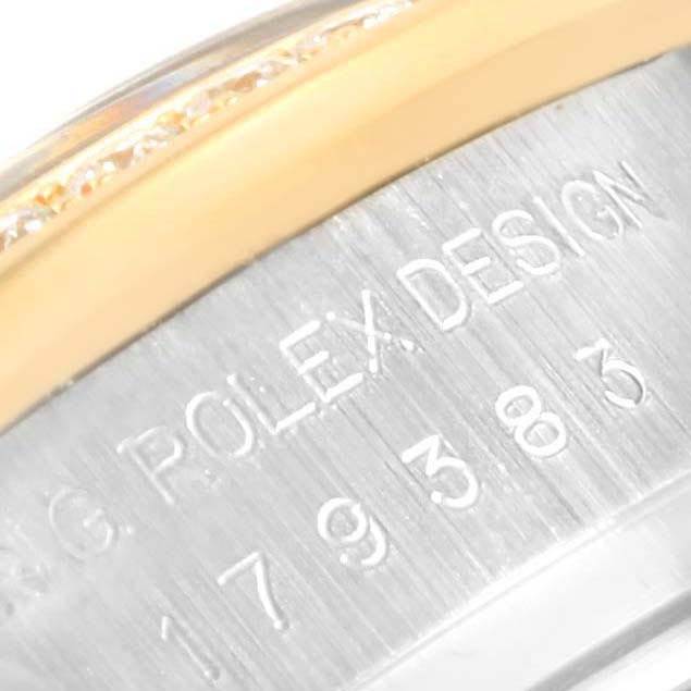 This close-up image shows the serial number and engraved "ROLEX DESIGN" of a Rolex Datejust 179383 Women's Steel and Gold (two tone) Champagne Dial 179383 Women's Steel and Gold (two tone) Champagne Dial model.