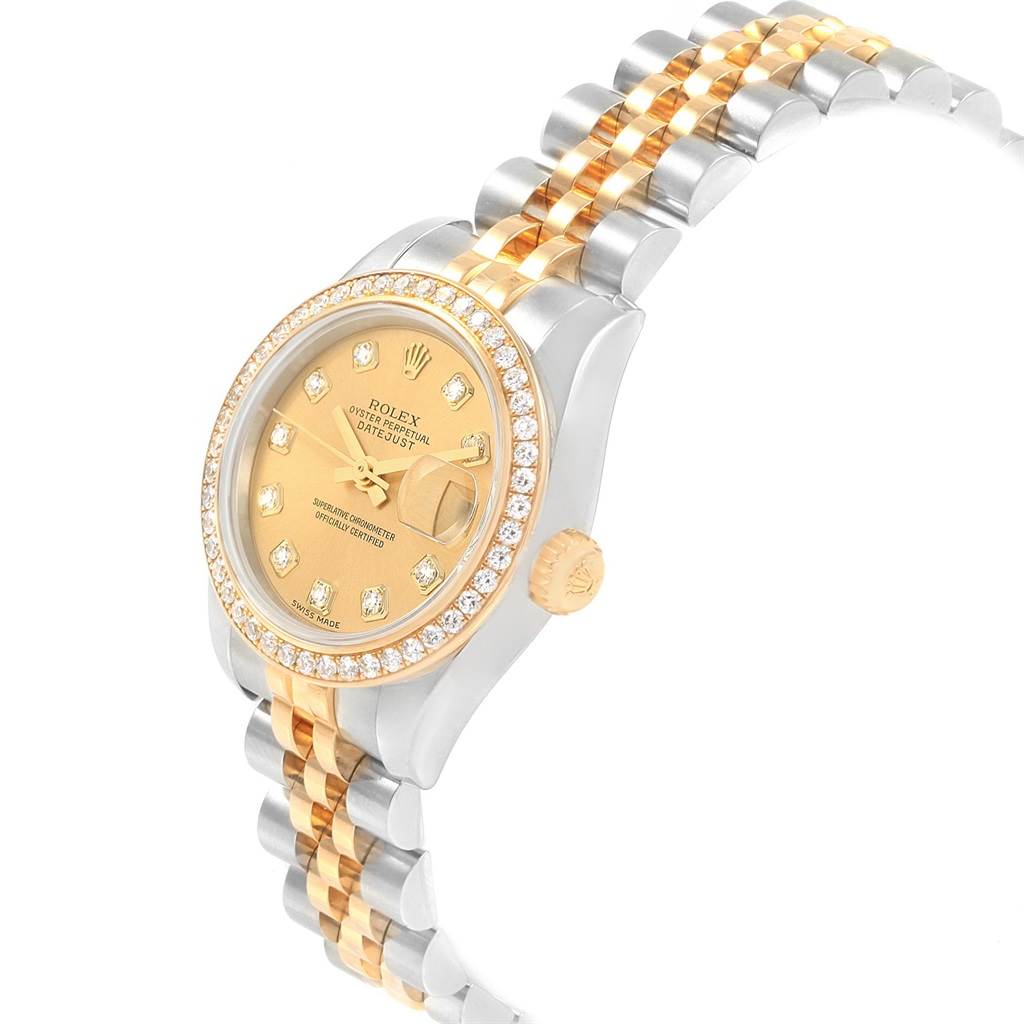 The Rolex Datejust 179383 Women's Steel and Gold (two tone) Champagne Dial 179383 Women's Steel and Gold (two tone) Champagne Dial watch is shown at an angled side view, highlighting its diamond bezel, gold dial, and two-tone bracelet.