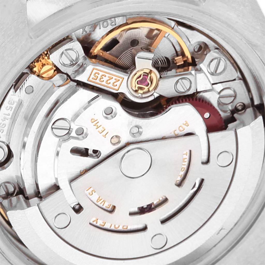 This image shows a close-up of the internal mechanism of a Rolex Datejust 179383 Women's Steel and Gold (two tone) Champagne Dial 179383 Women's Steel and Gold (two tone) Champagne Dial watch, including the rotor and balance wheel.