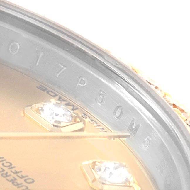 This close-up angle shows the inner bezel and dial with diamond hour markers of a Rolex Datejust 179383 Women's Steel and Gold (two tone) Champagne Dial 179383 Women's Steel and Gold (two tone) Champagne Dial watch.