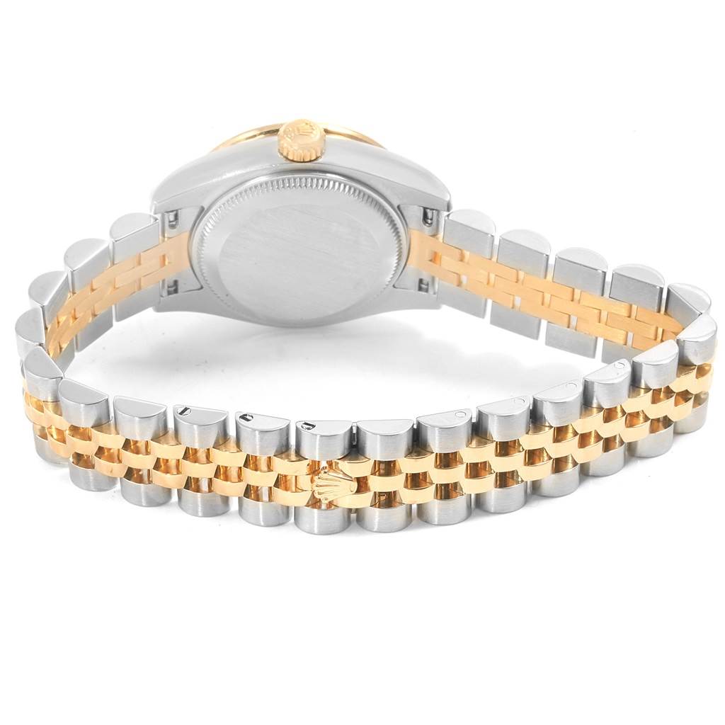 The image shows the back of a Rolex Datejust 179383 Women's Steel and Gold (two tone) Champagne Dial 179383 Women's Steel and Gold (two tone) Champagne Dial watch, highlighting its two-tone Jubilee bracelet and crown.