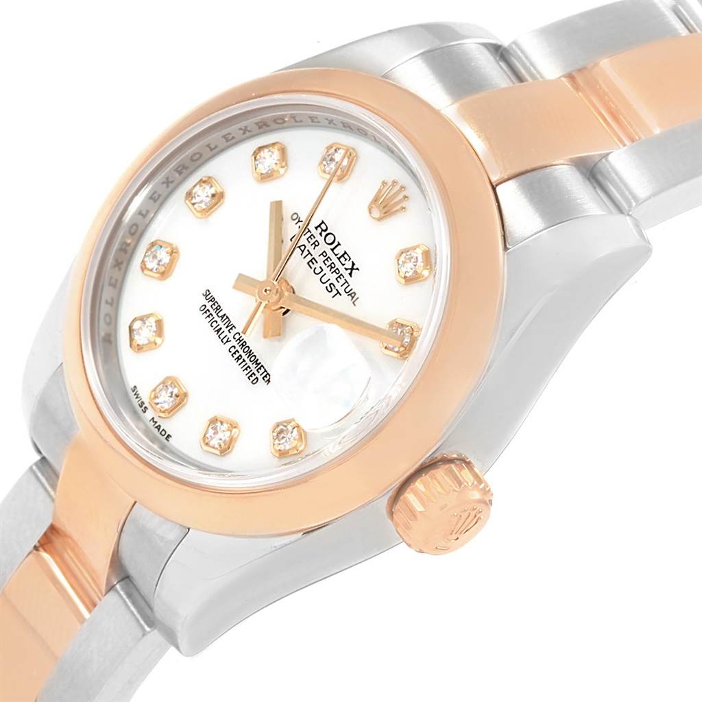 This image shows a close-up side angle of a Rolex Datejust 179161 Women's Steel and Gold (two tone) White Dial 179161 Women's Steel and Gold (two tone) White Dial watch, detailing the dial, hands, crown, and part of the bracelet.