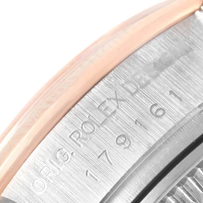 This image shows a close-up of the engraved inner bezel of a Rolex Datejust 179161 Women's Steel and Gold (two tone) White Dial 179161 Women's Steel and Gold (two tone) White Dial watch.