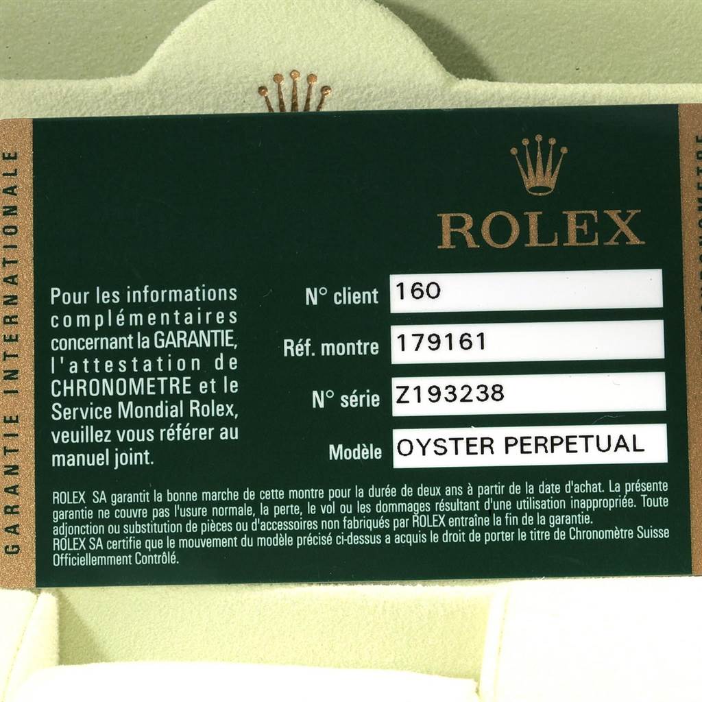 The image shows a warranty card for a Rolex Oyster Perpetual Datejust watch with information such as model and serial number.