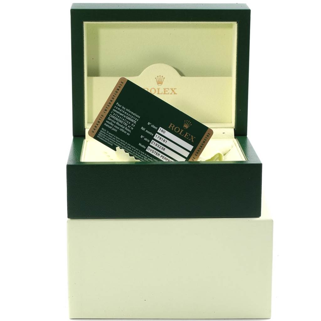 The image shows a Rolex Datejust 179161 Women's Steel and Gold (two tone) White Dial 179161 Women's Steel and Gold (two tone) White Dial box with an authenticity card placed inside.