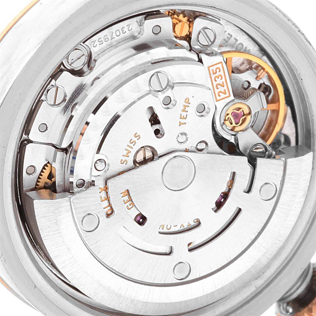 This is a close-up view of the internal movement mechanism of a Rolex Datejust 179161 Women's Steel and Gold (two tone) Pink Dial 179161 Women's Steel and Gold (two tone) Pink Dial watch.