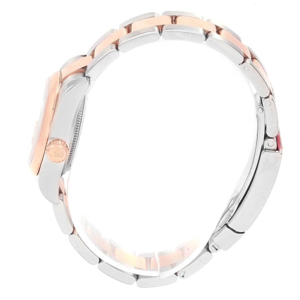 The image shows a side view of the Rolex Datejust 179161 Women's Steel and Gold (two tone) Pink Dial 179161 Women's Steel and Gold (two tone) Pink Dial watch, highlighting its case, crown, and two-tone bracelet.