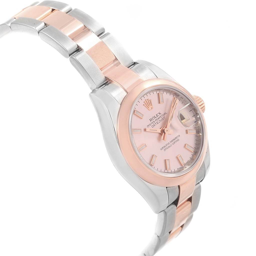 The image shows a side angled view of a Rolex Datejust 179161 Women's Steel and Gold (two tone) Pink Dial 179161 Women's Steel and Gold (two tone) Pink Dial watch, highlighting its two-tone bracelet, case, dial, and crown.