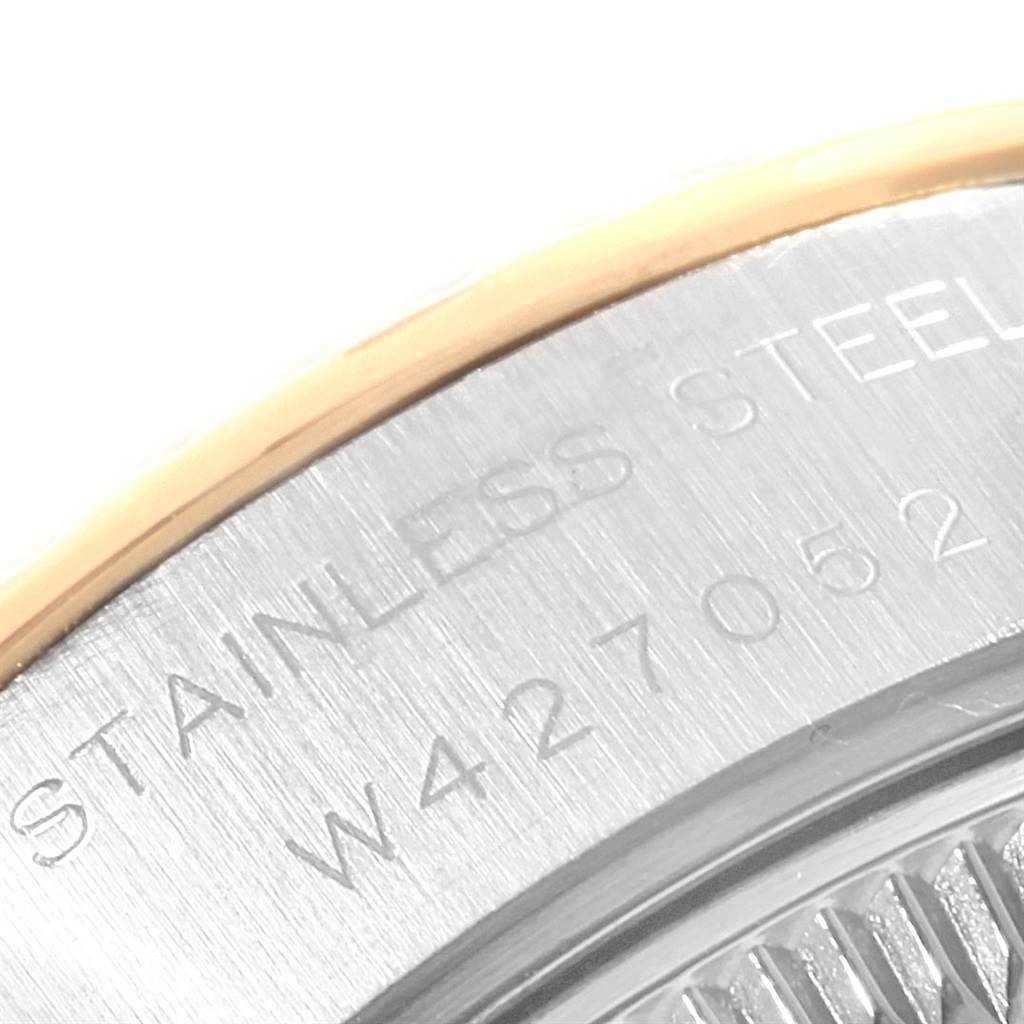 This image shows a close-up of the side of the casing on a Rolex Datejust 69173 Women's Stainless Steel White Dial 69173 Women's Stainless Steel White Dial watch, highlighting part of the stainless steel and the serial number.