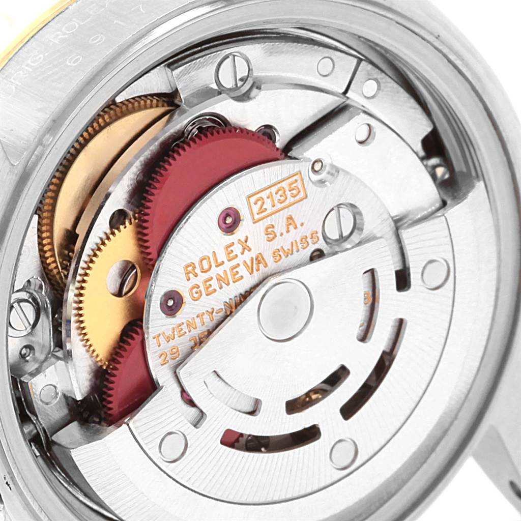 This image shows the internal mechanism of a Rolex Datejust 69173 Women's Stainless Steel White Dial 69173 Women's Stainless Steel White Dial model watch, highlighting the gears and movement components.