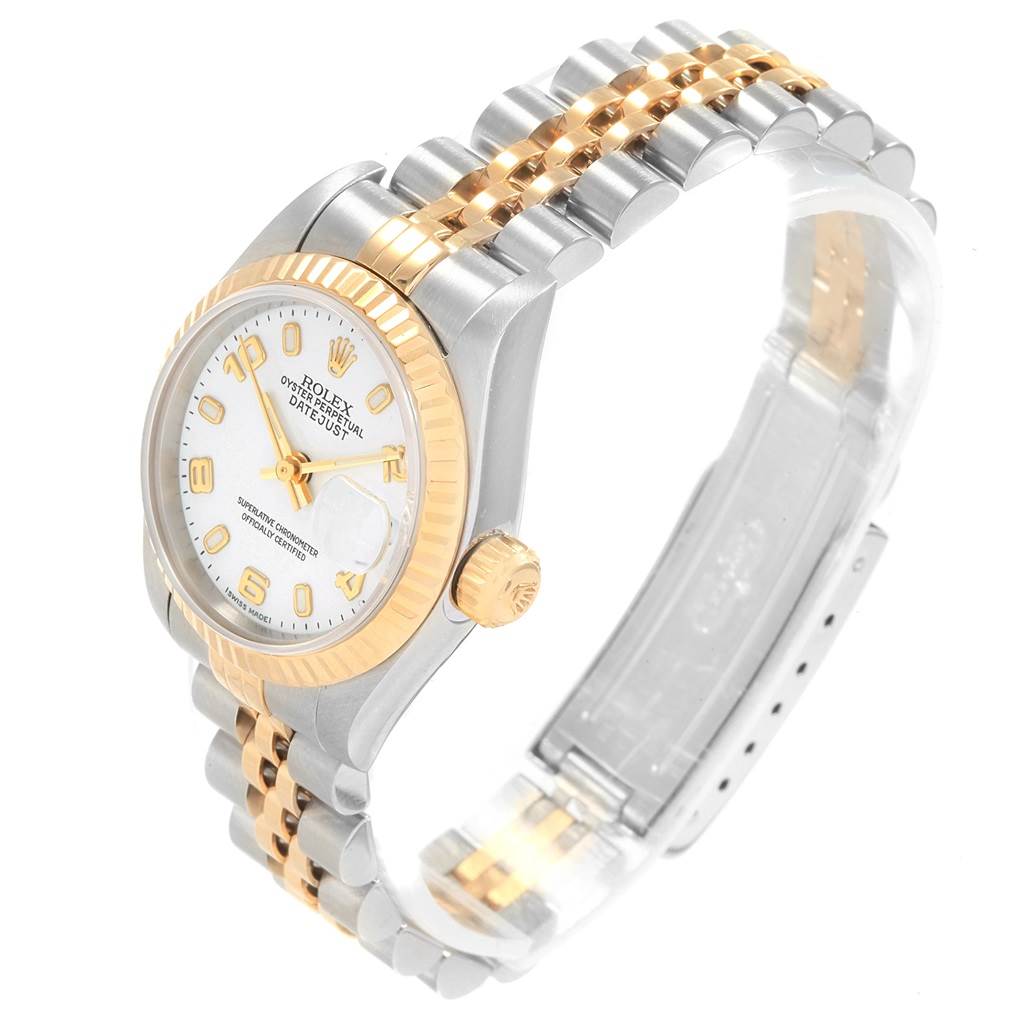This image shows a Rolex Datejust 69173 Women's Stainless Steel White Dial 69173 Women's Stainless Steel White Dial watch at an oblique angle, highlighting the two-tone bracelet, dial, fluted bezel, and crown.