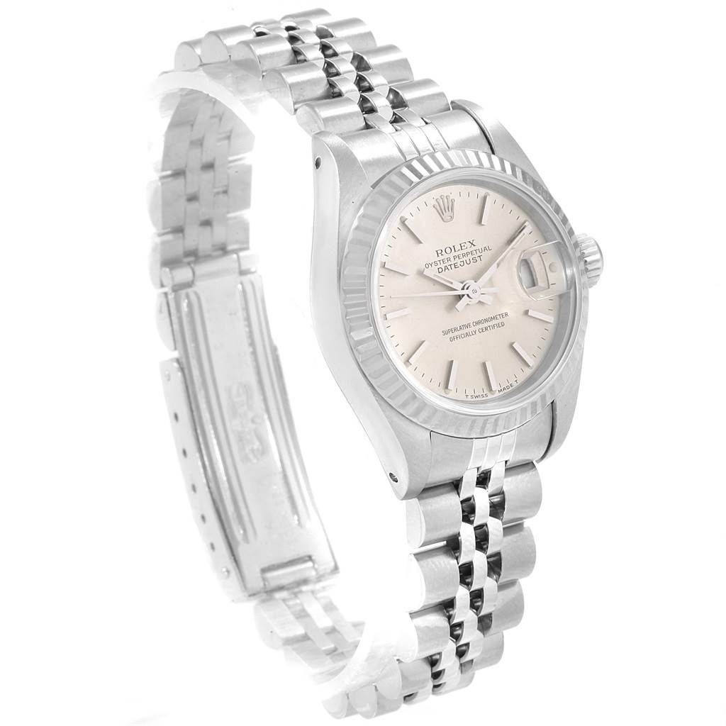 This image shows a Rolex Datejust 69174 Women's Stainless Steel Silver Dial 69174 Women's Stainless Steel Silver Dial watch from a three-quarter angle, highlighting its face, fluted bezel, and Jubilee bracelet.