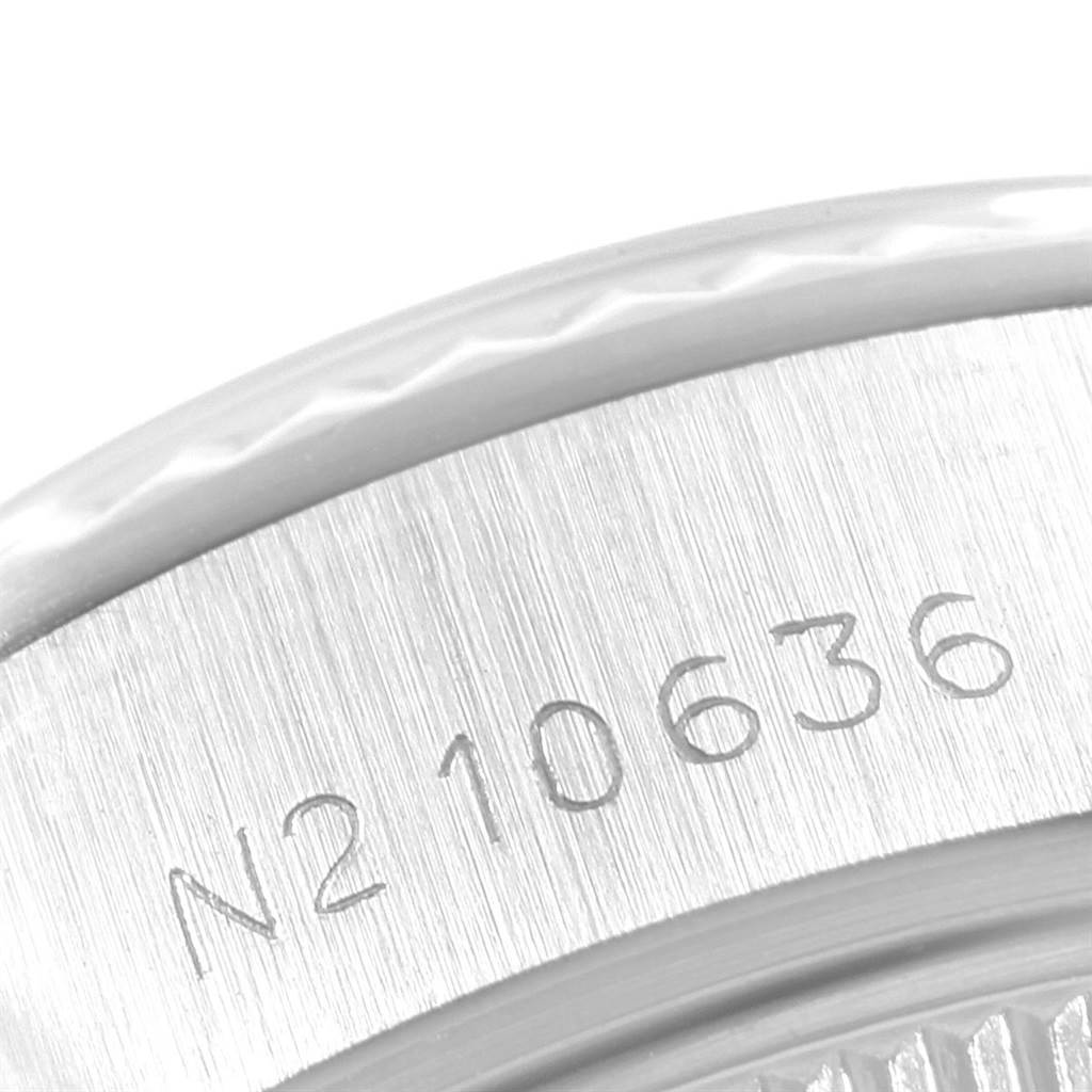 The image shows a close-up of the serial number engraved on the side of a Rolex Datejust 69174 Women's Stainless Steel Silver Dial 69174 Women's Stainless Steel Silver Dial watch case.