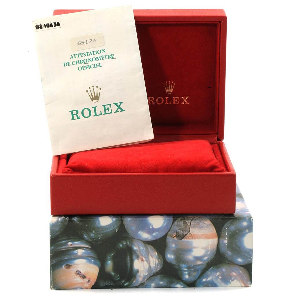 The image shows a Rolex Datejust 69174 Women's Stainless Steel Silver Dial 69174 Women's Stainless Steel Silver Dial watch box, red interior, a document, and an outer box.