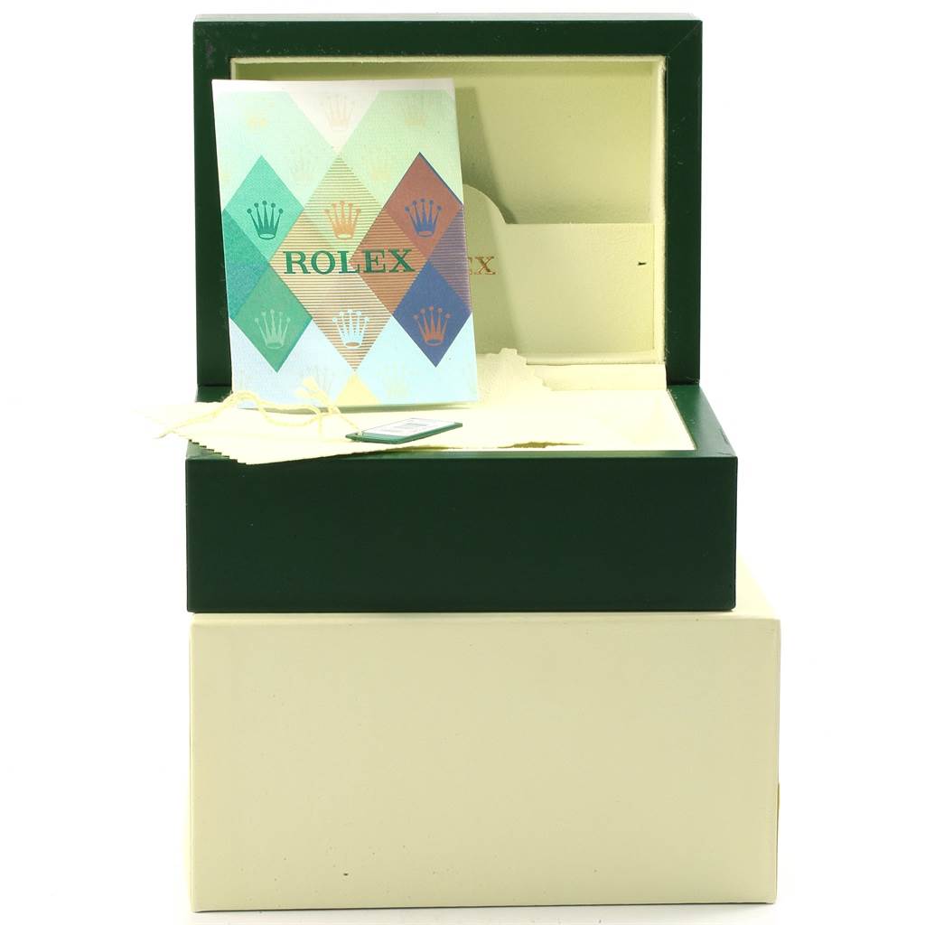 The image shows the packaging and warranty card for a Rolex Datejust 179173 Women's Steel and Gold (two tone) Silver Dial 179173 Women's Steel and Gold (two tone) Silver Dial watch, with the green box partially open.