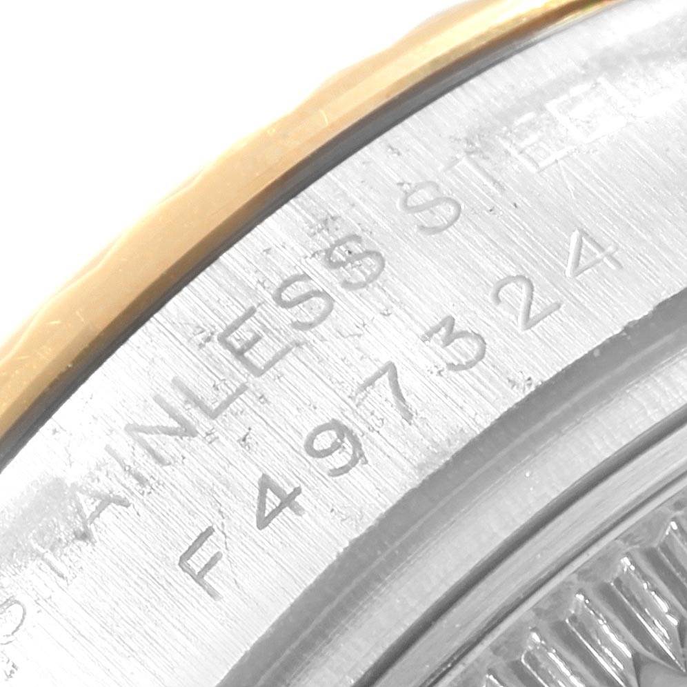 The image shows a close-up of the side engraving on the case bezel of a Rolex Datejust 179173 Women's Steel and Gold (two tone) Silver Dial 179173 Women's Steel and Gold (two tone) Silver Dial watch.