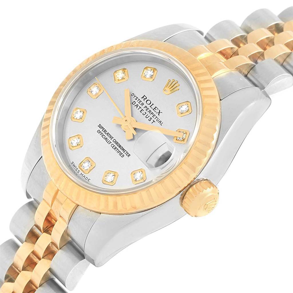 The image shows a Rolex Datejust 179173 Women's Steel and Gold (two tone) Silver Dial 179173 Women's Steel and Gold (two tone) Silver Dial watch at an angle displaying the face, crown, fluted bezel, and two-tone jubilee bracelet.