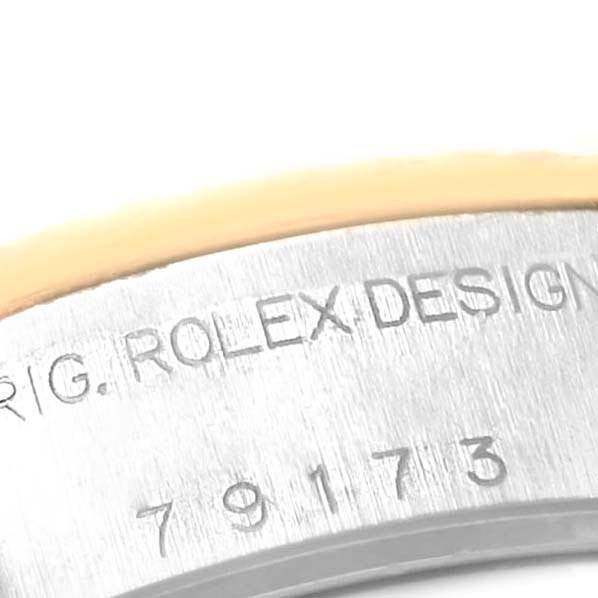 The image shows a close-up of the model number and engraving on the case of a Rolex Datejust 79173 Women's Steel and Gold (two tone) White Dial 79173 Women's Steel and Gold (two tone) White Dial watch.