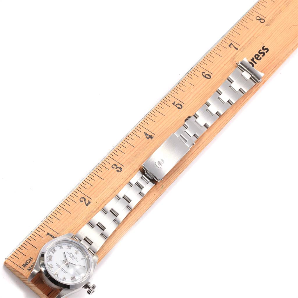The image shows a Rolex Datejust 79160 Women's Stainless Steel White Dial 79160 Women's Stainless Steel White Dial watch laid flat with a ruler, displaying its face and bracelet.