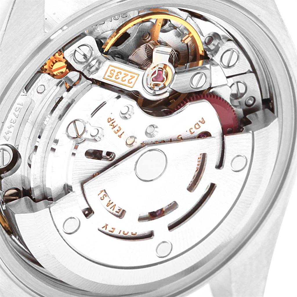 The image shows a close-up of the internal mechanics of a Rolex Datejust 79160 Women's Stainless Steel White Dial 79160 Women's Stainless Steel White Dial watch, focusing on the rotor and movement components.