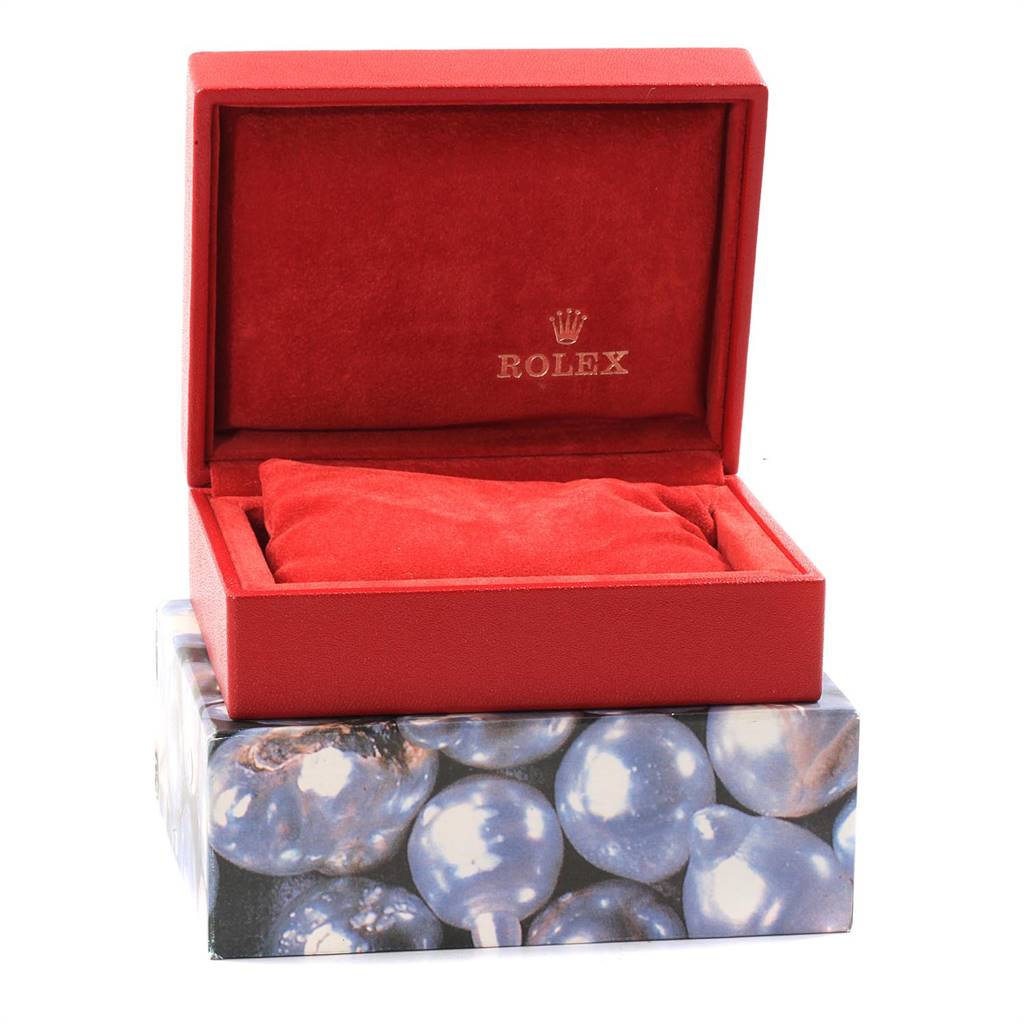 This image shows a red Rolex watch box for the Datejust model, with the lid open and a cushioned interior.