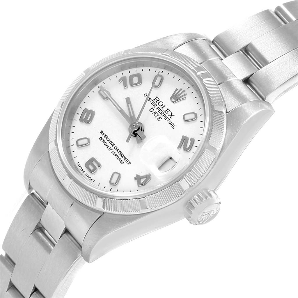 The image shows a close-up of a Rolex Datejust 79190 Women's Stainless Steel White Dial 79190 Women's Stainless Steel White Dial watch from an angled top-down view, highlighting the face, bezel, and part of the bracelet.