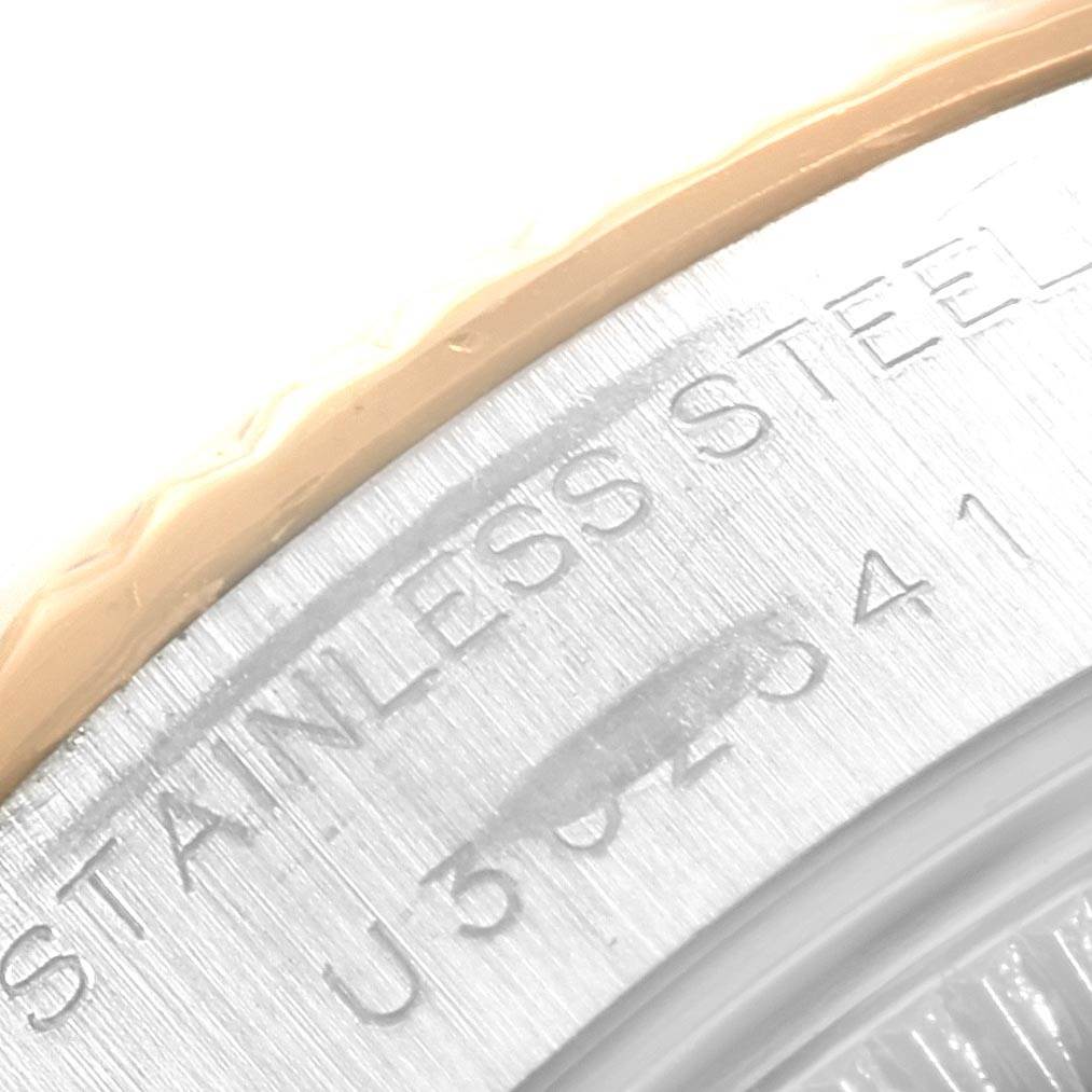 The image shows a close-up of the side engraving on a Rolex Datejust 69173 Women's Stainless Steel White Dial 69173 Women's Stainless Steel White Dial model watch, highlighting "STAINLESS STEEL."