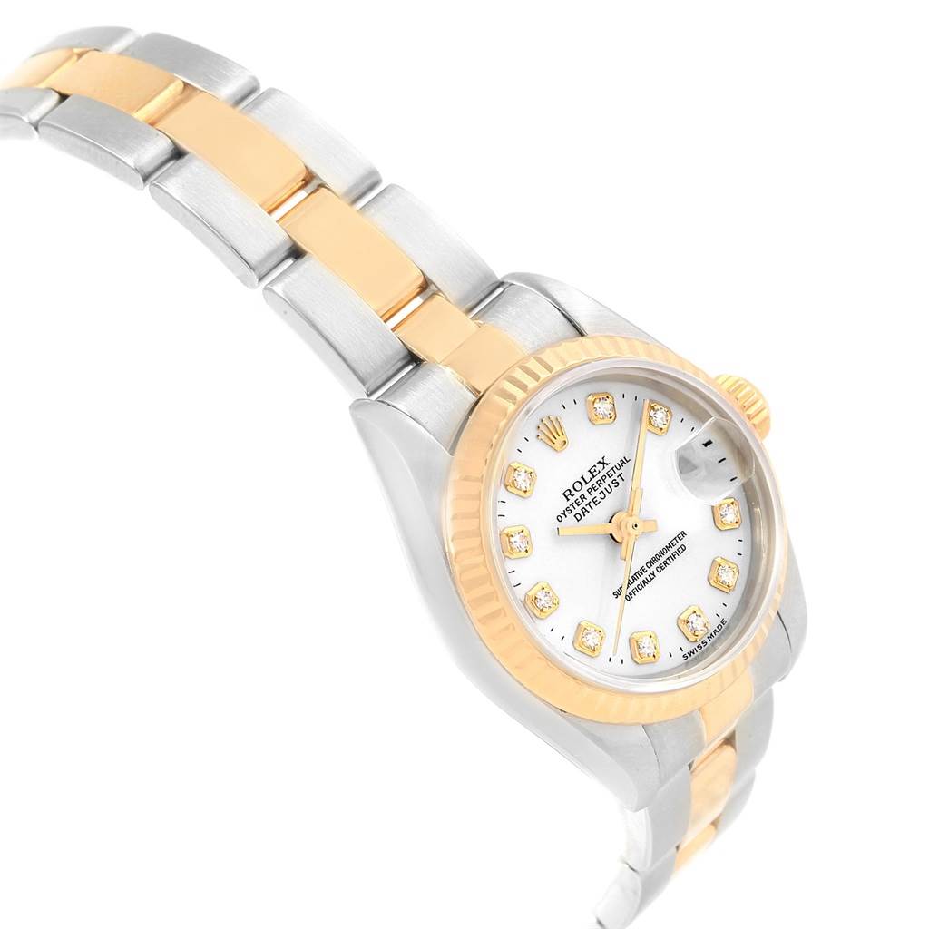 The image shows a Rolex Datejust 69173 Women's Stainless Steel White Dial 69173 Women's Stainless Steel White Dial watch at a three-quarter angle, highlighting the dial, fluted bezel, crown, and two-tone bracelet.