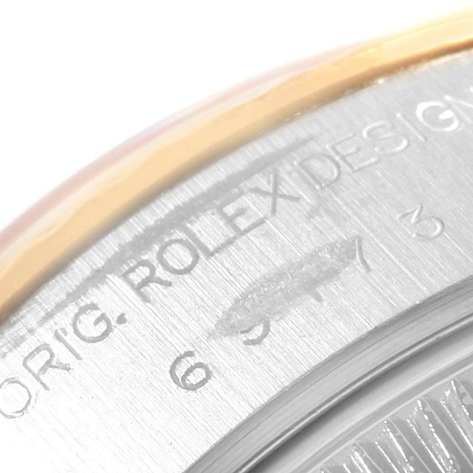 This close-up image shows the engraved details on the case back of a Rolex Datejust 69173 Women's Stainless Steel White Dial 69173 Women's Stainless Steel White Dial watch.