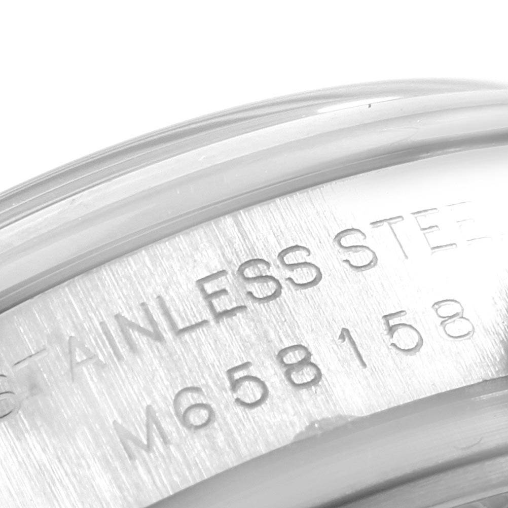 This image shows a close-up view of the serial number engraving on the case side of a Rolex Datejust 179160 Women's Stainless Steel White Dial 179160 Women's Stainless Steel White Dial model watch.