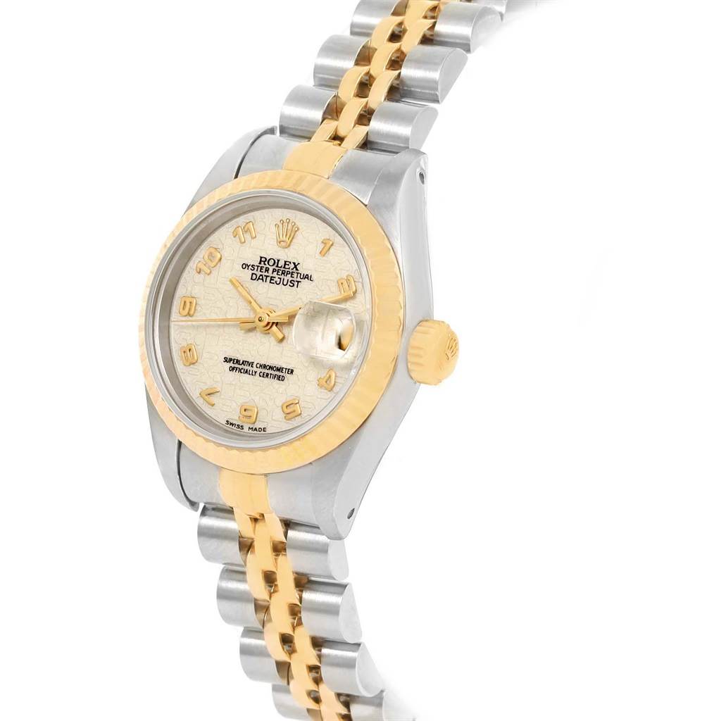 The Rolex Datejust 69173 Women
s Stainless Steel Beige Dial 69173 Women
s Stainless Steel Beige Dial watch is shown at an angle highlighting its dial, bezel, crown, and two-tone metal bracelet.