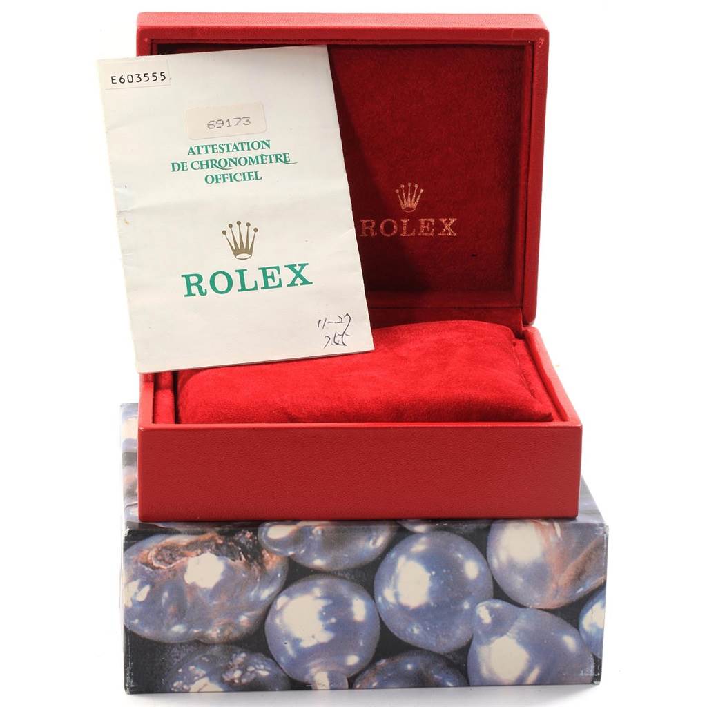 This image shows an open red Rolex box with red interior, containing documentation for a Rolex Datejust 69173 Women
s Stainless Steel Beige Dial 69173 Women
s Stainless Steel Beige Dial model.