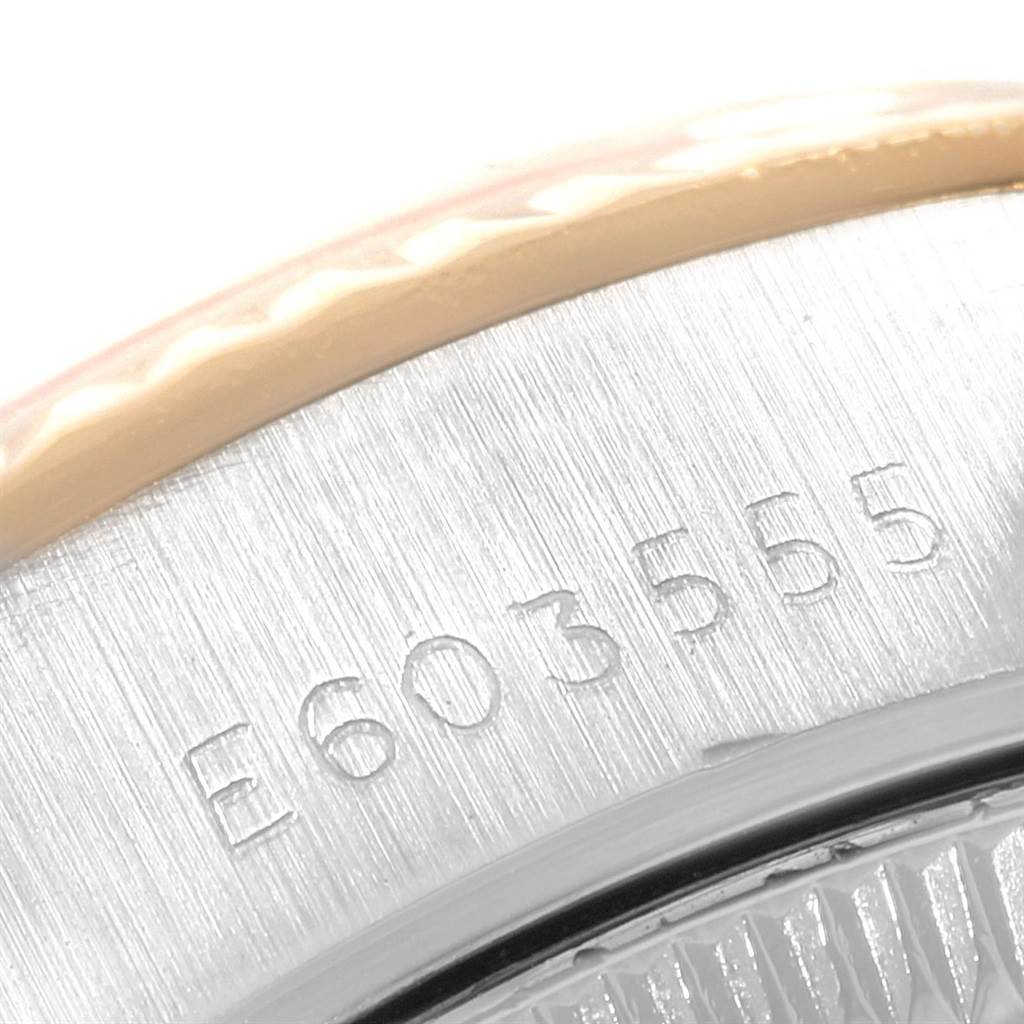 This image shows a close-up of the serial number on the case back edge of a Rolex Datejust 69173 Women
s Stainless Steel Beige Dial 69173 Women
s Stainless Steel Beige Dial watch.