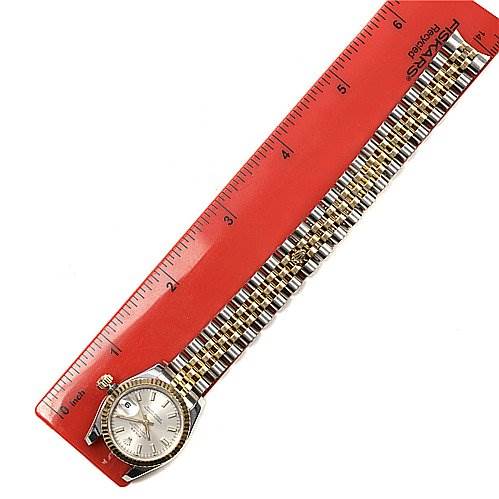 The Rolex Datejust 179173 Women's Stainless Steel White Dial 179173 Women's Stainless Steel White Dial watch is shown from the front, placed next to a ruler to measure its length, with its bracelet fully extended.