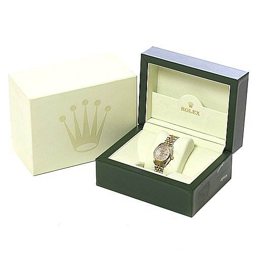 The image shows a Rolex Datejust 179173 Women's Stainless Steel White Dial 179173 Women's Stainless Steel White Dial watch in a partially open green and beige box, alongside its outer packaging box.